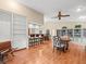 Spacious living room featuring bar seating, built-in shelving, and wood floors at 24104 Peppermill Dr, Brooksville, FL 34601