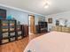 Main bedroom featuring a large dresser and access to the primary bathroom at 24104 Peppermill Dr, Brooksville, FL 34601