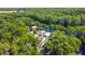 Captivating aerial showing homes nestled along a tranquil waterfront, embraced by trees, creating a picturesque haven at 28330 Peterson Camp Rd, Brooksville, FL 34601