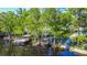 A beautiful backyard view featuring docks and a walkway, perfect for enjoying the river at 28330 Peterson Camp Rd, Brooksville, FL 34601