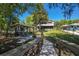 Beautiful backyard with patio, fountain, grilling area, and waterfront access at 28330 Peterson Camp Rd, Brooksville, FL 34601