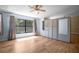 Bedroom featuring wood-look floors, built in storage, and natural light at 28330 Peterson Camp Rd, Brooksville, FL 34601