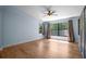 Bedroom with ceiling fan, wood-look floors, and lots of natural light at 28330 Peterson Camp Rd, Brooksville, FL 34601