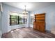 Dining area featuring bay window views, wood floors, and built in hutch at 28330 Peterson Camp Rd, Brooksville, FL 34601