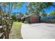 Charming two-story home featuring a well-maintained lawn, gray exterior paint, and a cozy, welcoming presence at 28330 Peterson Camp Rd, Brooksville, FL 34601