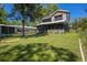 Charming two-story home with lots of windows and beautiful green lawn at 28330 Peterson Camp Rd, Brooksville, FL 34601