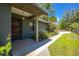 Charming front porch with elegant columns, manicured landscaping, and a welcoming entrance at 28330 Peterson Camp Rd, Brooksville, FL 34601