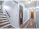 Bright hallway features wood-look floors, fresh paint, and stairs to the second floor at 28330 Peterson Camp Rd, Brooksville, FL 34601