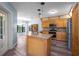Well-lit kitchen featuring an island with sink, granite countertops, and stainless steel appliances at 28330 Peterson Camp Rd, Brooksville, FL 34601