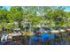 Stunning riverfront property featuring docks, a pavilion, and verdant trees at 28330 Peterson Camp Rd, Brooksville, FL 34601