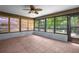 Sunroom featuring tile floors, neutral paint, and lots of natural light at 28330 Peterson Camp Rd, Brooksville, FL 34601