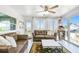 Bright living room with leather sofas, large windows, and view to the outside at 3009 7Th Avenue E Cir, Bradenton, FL 34208