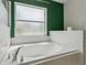 Bathroom tub featuring a white tile backsplash and chrome faucet at 3017 Aldoro Ave, Spring Hill, FL 34609