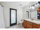 Bathroom boasts a single sink vanity, toilet, and glass door walk-in shower at 3017 Aldoro Ave, Spring Hill, FL 34609