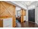 The foyer features stylish wood-look floors and decorative sliding barn doors leading to another room at 3017 Aldoro Ave, Spring Hill, FL 34609