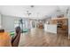 Bright and airy living room features a ceiling fan, open layout, and access to the dining area at 3017 Aldoro Ave, Spring Hill, FL 34609
