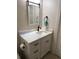 Bathroom featuring stylish vanity with marble countertop and sleek black fixtures at 3037 Leroy W St, Tampa, FL 33607