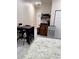 Bedroom including a kitchenette, table, and plenty of storage space at 3037 Leroy W St, Tampa, FL 33607