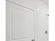 Clean bathroom featuring a white door and tiled shower with modern fixtures at 30839 Penny Surf Loop, Wesley Chapel, FL 33545