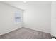 Bedroom featuring neutral carpet, natural light, and white walls at 30839 Penny Surf Loop, Wesley Chapel, FL 33545