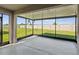 Screened lanai overlooking a manicured backyard with a view of the fence at 30839 Penny Surf Loop, Wesley Chapel, FL 33545