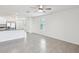 Living room features tile floors and views of the kitchen and entry area at 30839 Penny Surf Loop, Wesley Chapel, FL 33545