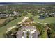 Stunning aerial view of property on a beautiful golf course and green landscape at 3160 Whispering Pines Ct, Spring Hill, FL 34606