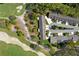 Aerial view showcasing the residential community and a nearby golf course at 3160 Whispering Pines Ct, Spring Hill, FL 34606