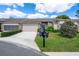 Charming home with a well-maintained front yard and a two-car garage at 3160 Whispering Pines Ct, Spring Hill, FL 34606