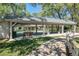 Covered pickleball courts with benches providing a comfortable recreational space at 3160 Whispering Pines Ct, Spring Hill, FL 34606