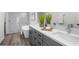Modern bathroom boasting double sinks, soaking tub, and luxurious marble shower at 3416 Lema Dr, Spring Hill, FL 34609