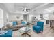 Open-concept living room flowing into the kitchen, featuring modern decor and plenty of natural light at 3416 Lema Dr, Spring Hill, FL 34609