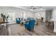 Bright living room with stylish furniture, wood-look floors, and a ceiling fan at 3416 Lema Dr, Spring Hill, FL 34609