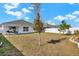 A view of a flat backyard, with fencing, plants and a patio at 4004 Autumn Amber Dr, Spring Hill, FL 34609
