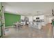 Well-lit open eat-in kitchen features an island with seating, stainless steel appliances, and granite countertops at 4004 Autumn Amber Dr, Spring Hill, FL 34609