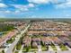 Community aerial view showcasing single-Gathering homes, scenic streets, and lush green spaces at 4012 Dragonfly Trl, Odessa, FL 33556