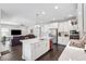 Elegant kitchen flows into the living space, boasting modern appliances and a large island for gathering and cooking at 4012 Dragonfly Trl, Odessa, FL 33556