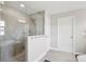 Modern bathroom featuring a glass-enclosed shower with stylish fixtures at 4012 Dragonfly Trl, Odessa, FL 33556