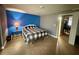 Bedroom with blue accent wall, neutral walls, ceramic tile floors and a queen-size bed at 4235 Sheldon Pl # 4235, New Port Richey, FL 34652