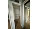 Open walk-in closet with adjustable shelving and mirrored closet doors on the right at 4235 Sheldon Pl # 4235, New Port Richey, FL 34652