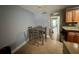 Cozy dining area with a classic table and chairs, adjacent to the kitchen, ideal for Gathering meals at 4235 Sheldon Pl # 4235, New Port Richey, FL 34652