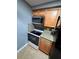 Functional kitchen with granite countertops, stainless steel appliances, and ample cabinet space at 4235 Sheldon Pl # 4235, New Port Richey, FL 34652