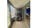 Laundry room features a stacked washer and dryer setup with shelving and natural light at 4235 Sheldon Pl # 4235, New Port Richey, FL 34652