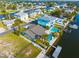 Aerial view of a home with a private pool and dock along a waterfront canal community at 4503 Jacona Dr, Hernando Beach, FL 34607