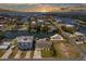 Sunset aerial view of waterfront community with private docks and ocean access at 4503 Jacona Dr, Hernando Beach, FL 34607