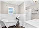 Beautiful bathroom with a luxurious clawfoot tub and modern fixtures at 4503 Jacona Dr, Hernando Beach, FL 34607