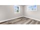 Minimalist bedroom with hardwood floors and neutral walls provides a clean, comfortable space at 4503 Jacona Dr, Hernando Beach, FL 34607