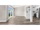 Dining area featuring gray wood floors, natural light and direct kitchen access at 4503 Jacona Dr, Hernando Beach, FL 34607
