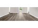 Spacious living area featuring wood flooring and natural light at 4503 Jacona Dr, Hernando Beach, FL 34607