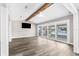 Spacious living room featuring new flooring and sliding glass doors to the patio at 4503 Jacona Dr, Hernando Beach, FL 34607